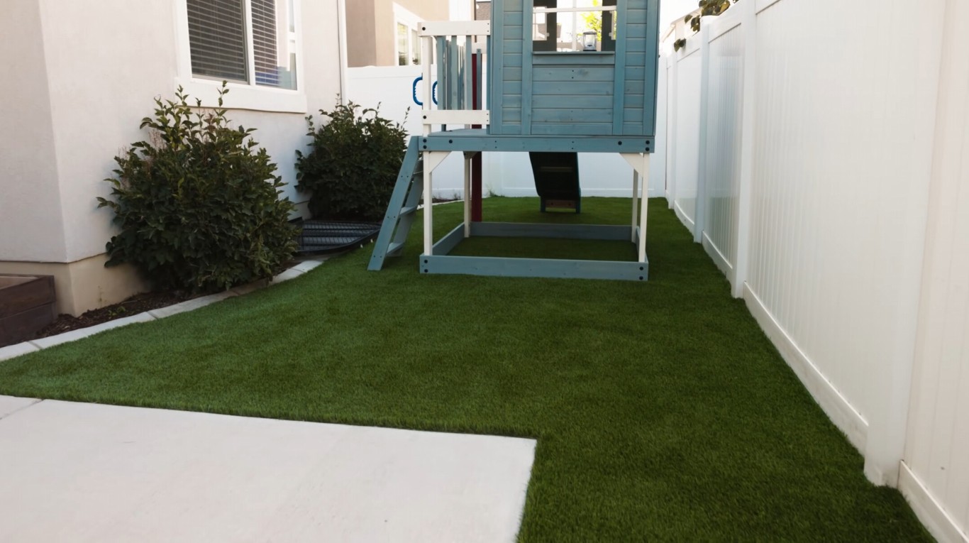 Professional residential artificial grass installation in Rogers, AR backyard